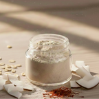Jaysrii Dew nourishing powdered face mask in a transparent jar with coconut pieces and saffron.